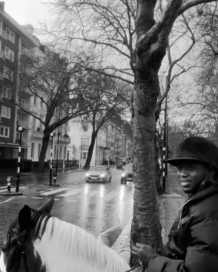 Ahmad Yari on horseback, in black and white